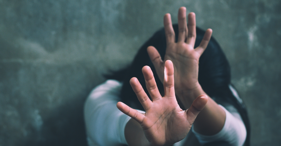 Woman on the floor with her hands up