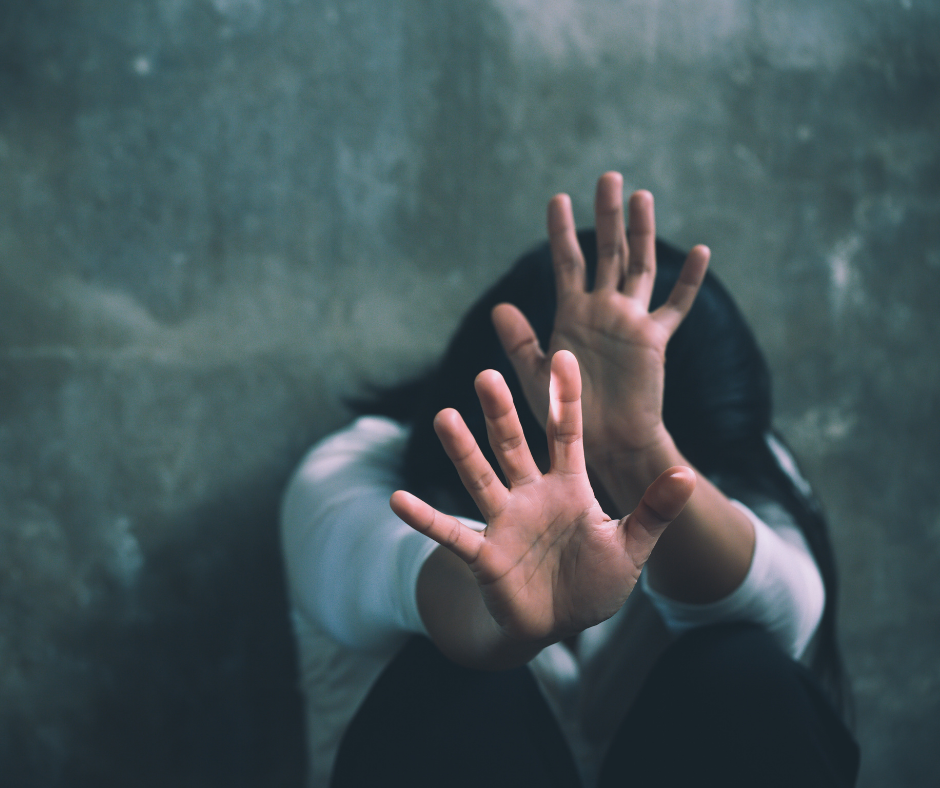 Woman on the floor with her hands up